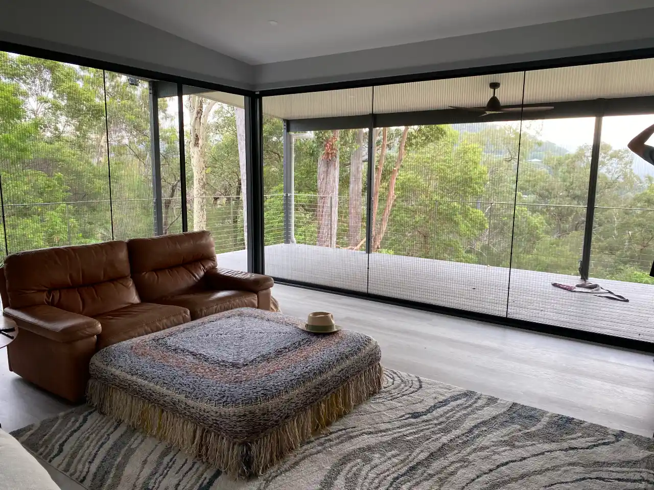 bush-outlook-lounge-room-with-corner-retractable-screens-opening-onto-big-deck-web-webP Bush Outlook Lounge Room with corner retractable screens showing the beauty of pleated screens and the unobstructed view out onto the bush and the deck.