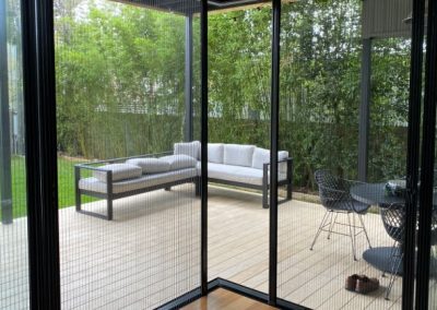 corner retractable fly screens in Robina looking out onto deck